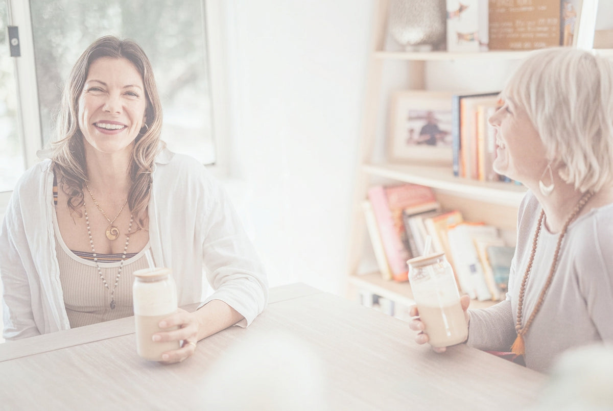 woman sipping gut-brain essentials drink