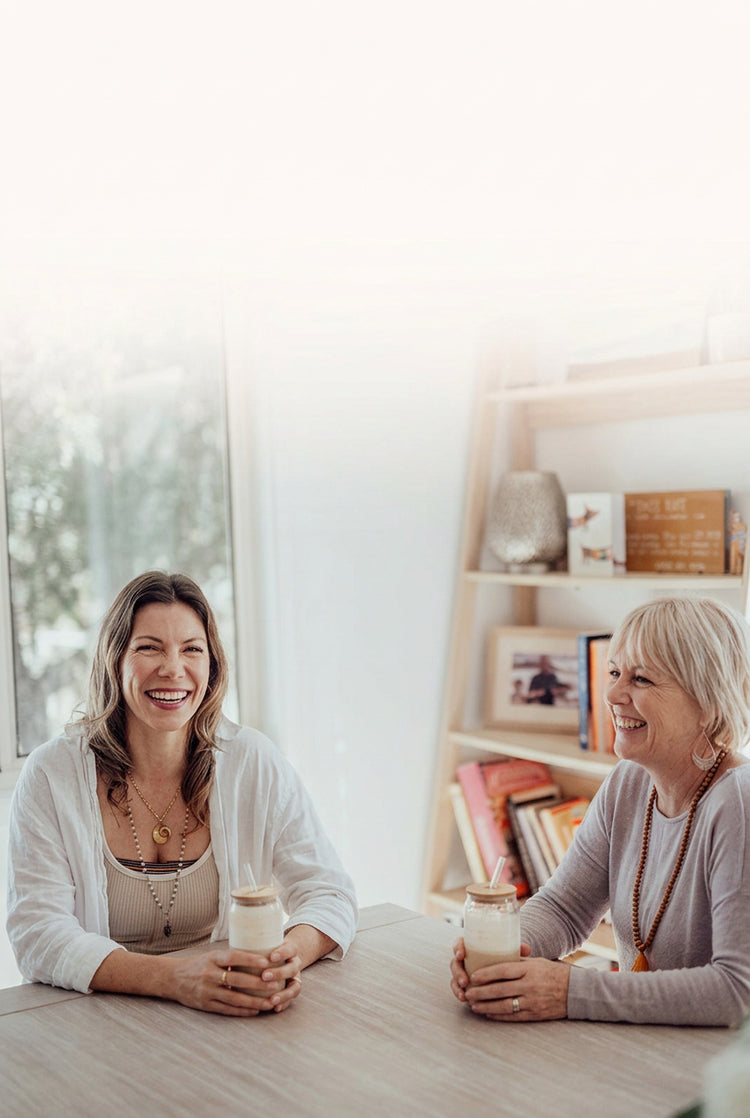 woman sipping gut-brain essentials drink